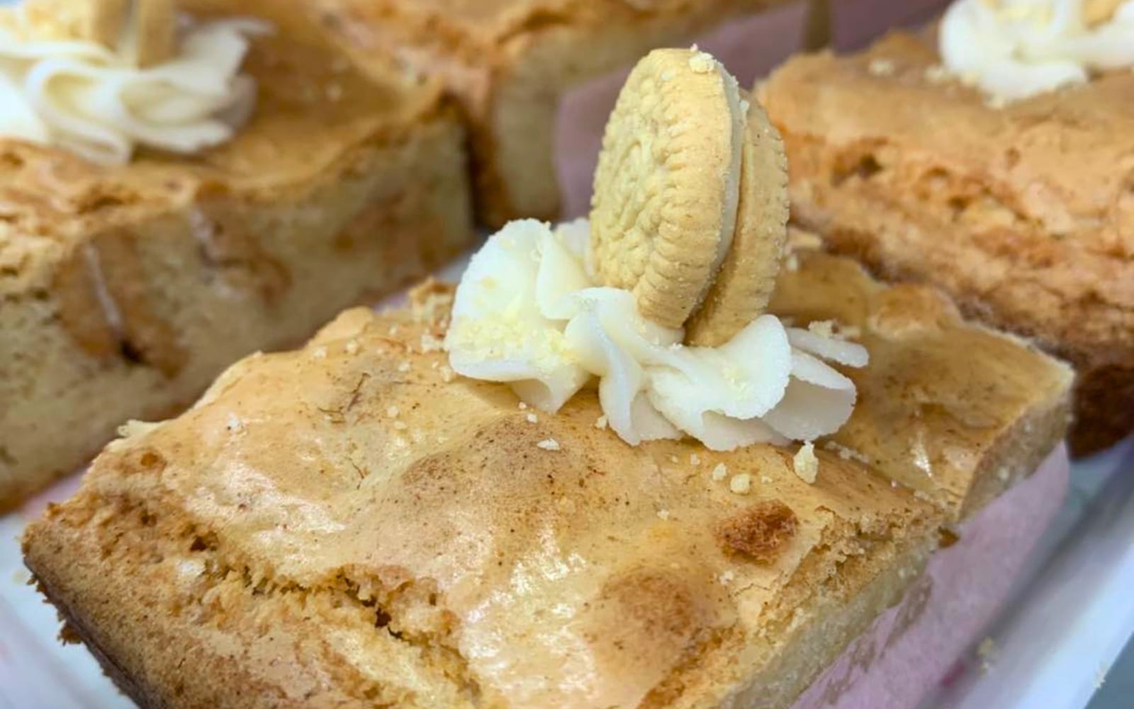 Key Lime Pie Bars at Pink Door Bakery Riverview FL topped with vanilla buttercream and lime zest