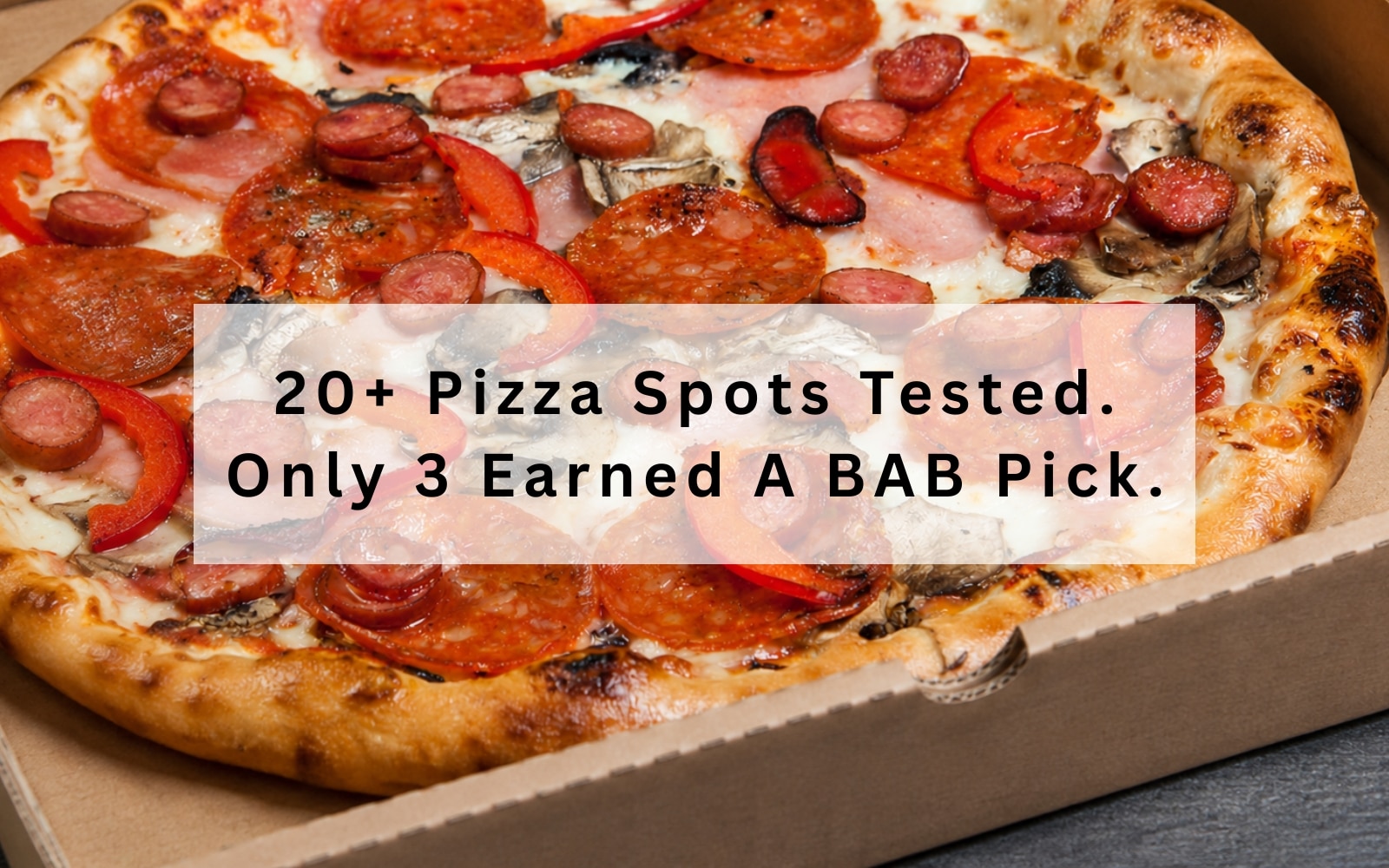 best pizza around Brandon FL loaded with meat toppings in a takeout box